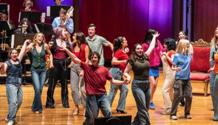 Performers dancing on stage 